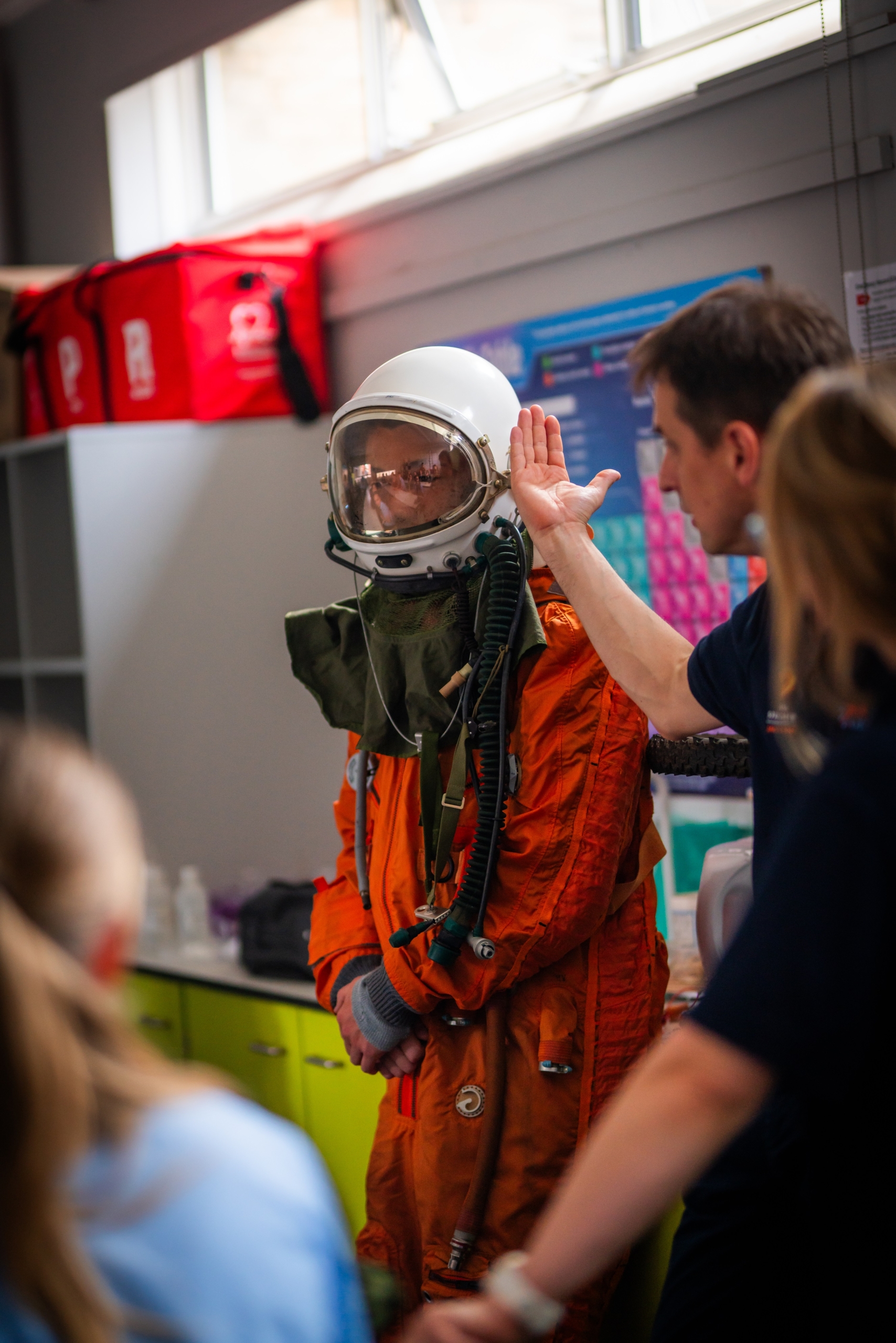 A student trying on a real pressure suit during an NSA Masterclass A student trying on a real pressure suit during an NSA Masterclass